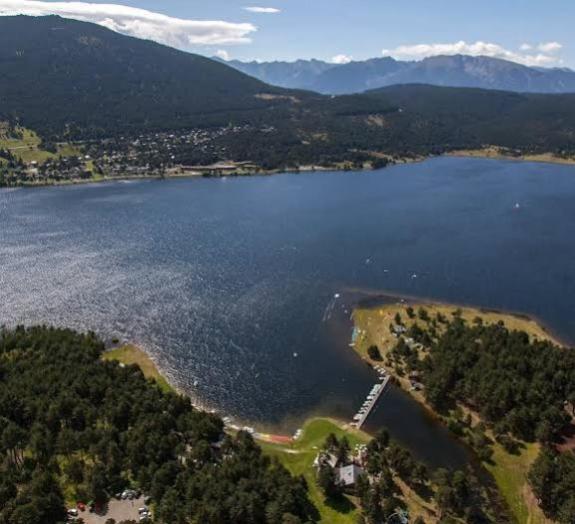 an aerial view of a large lake with mountains at Studio cabine 4 personnes in Les Angles