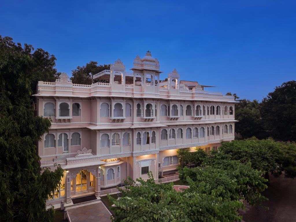 a large white building with a dome on top at Rampratap Palace by Fateh Collection in Udaipur