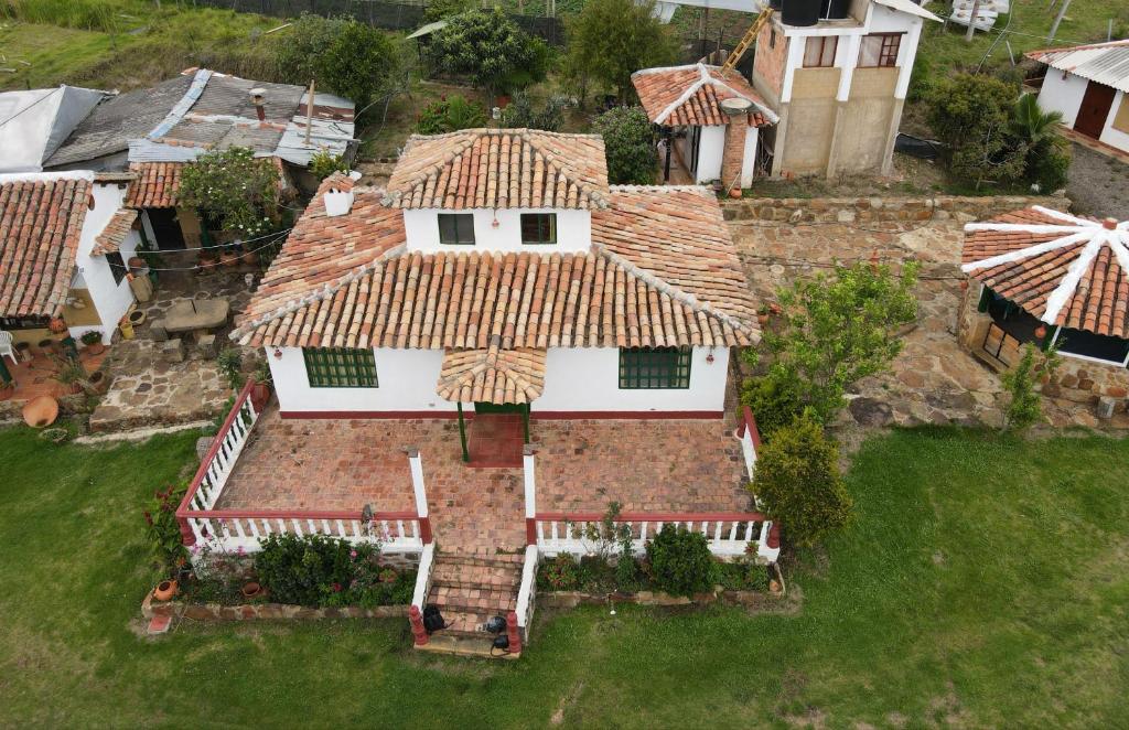 an aerial view of a large house with a roof at POSADA VILLA DEL ROSARiO in Sutamarchán
