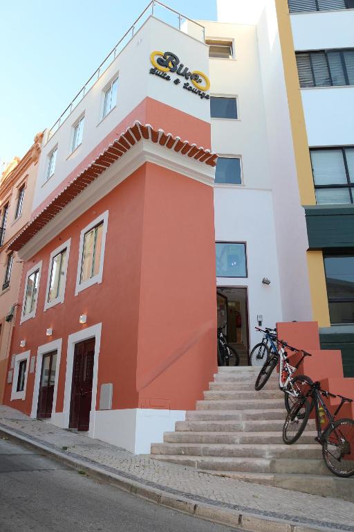 a building with bikes parked outside of it at Bike Suite in Figueira da Foz