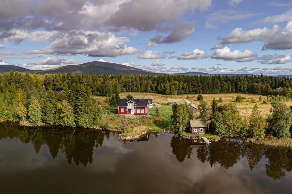 a house on an island in the middle of a lake at Villa Aattu in Muonio