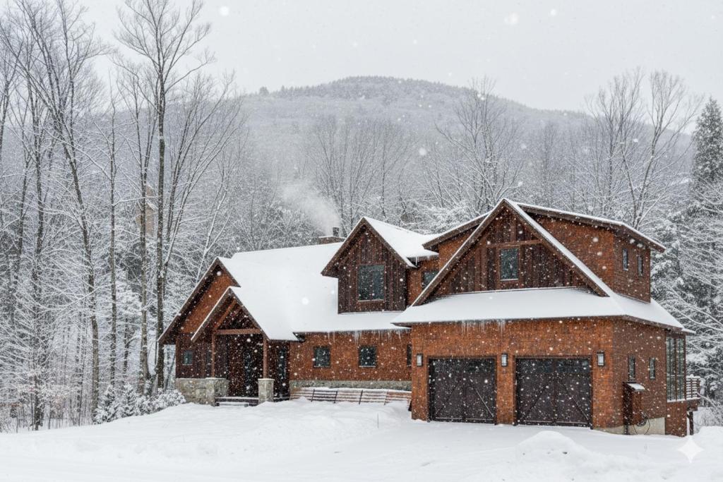 a barn with snow on the roof at Spectacular Ski In Hideaway Hot Tub - Views - Bbq in Lincoln