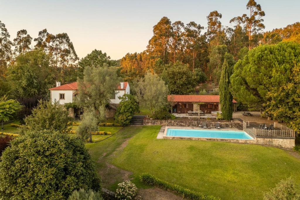 an aerial view of a yard with a swimming pool at Portugal Active São Julião Retreat | Pool, Jacuzzi & Garden Escape in Mato