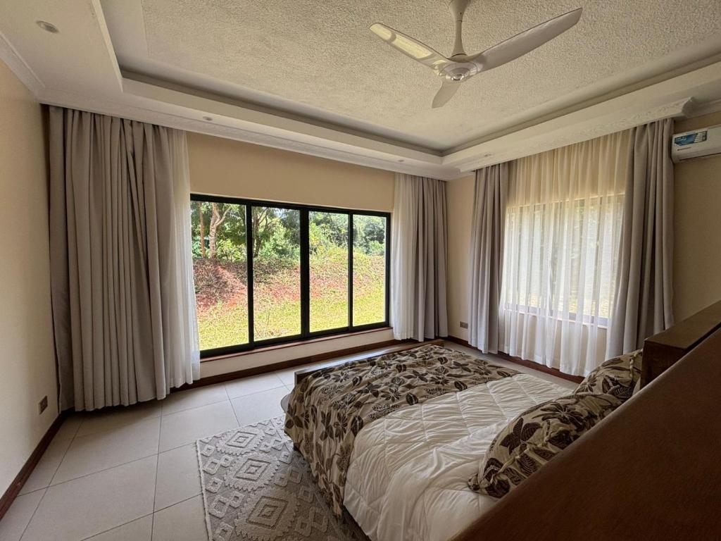 Ένα ή περισσότερα κρεβάτια σε δωμάτιο στο Mimunda Villa