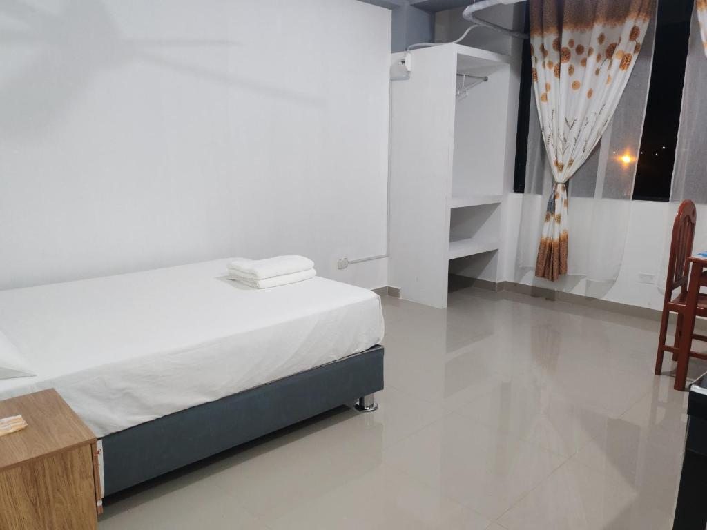Postel nebo postele na pokoji v ubytování Hospedaje Luciana