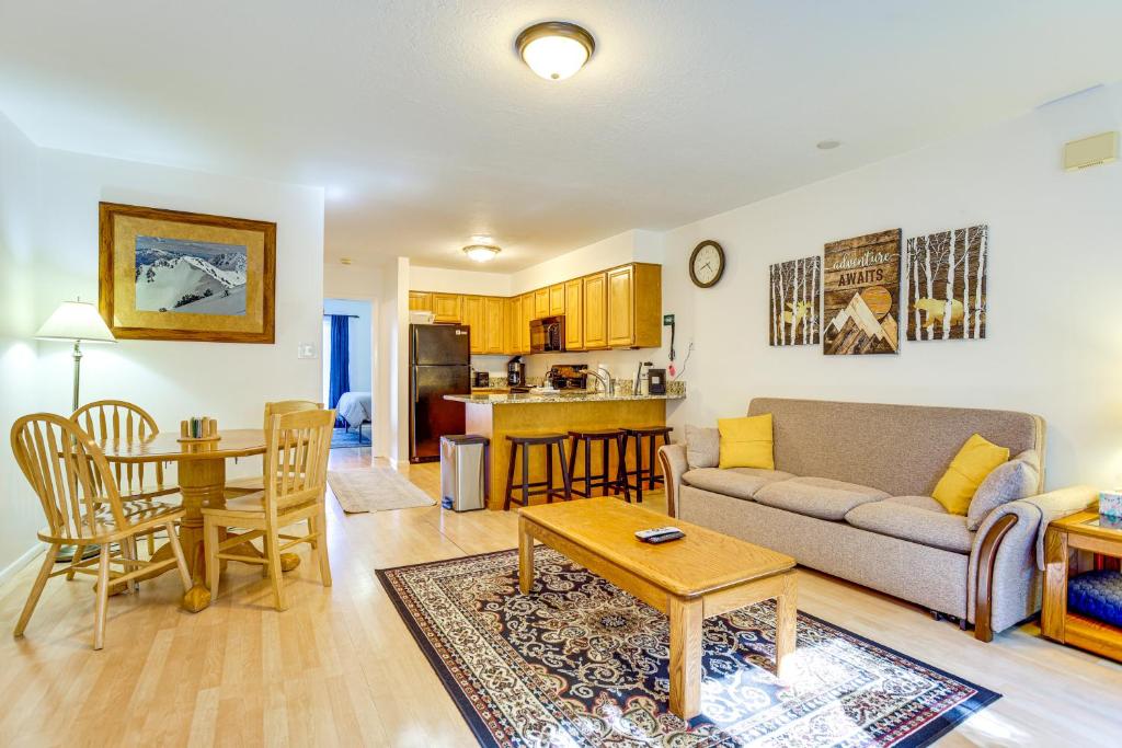 a living room with a couch and a table at Eden Mountain Escape with Community Pool! in Eden