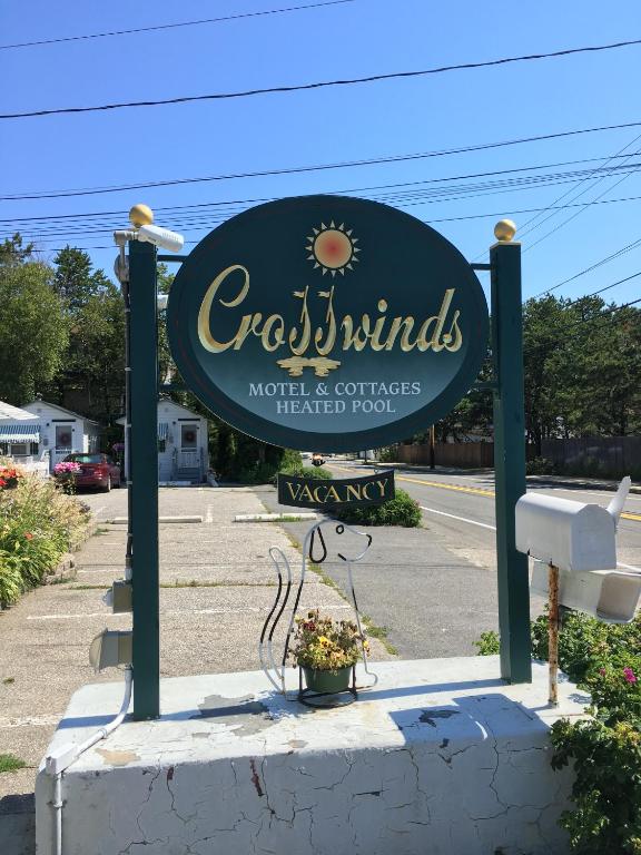 a sign for a restaurant in a parking lot at Crosswinds Motel in Old Orchard Beach