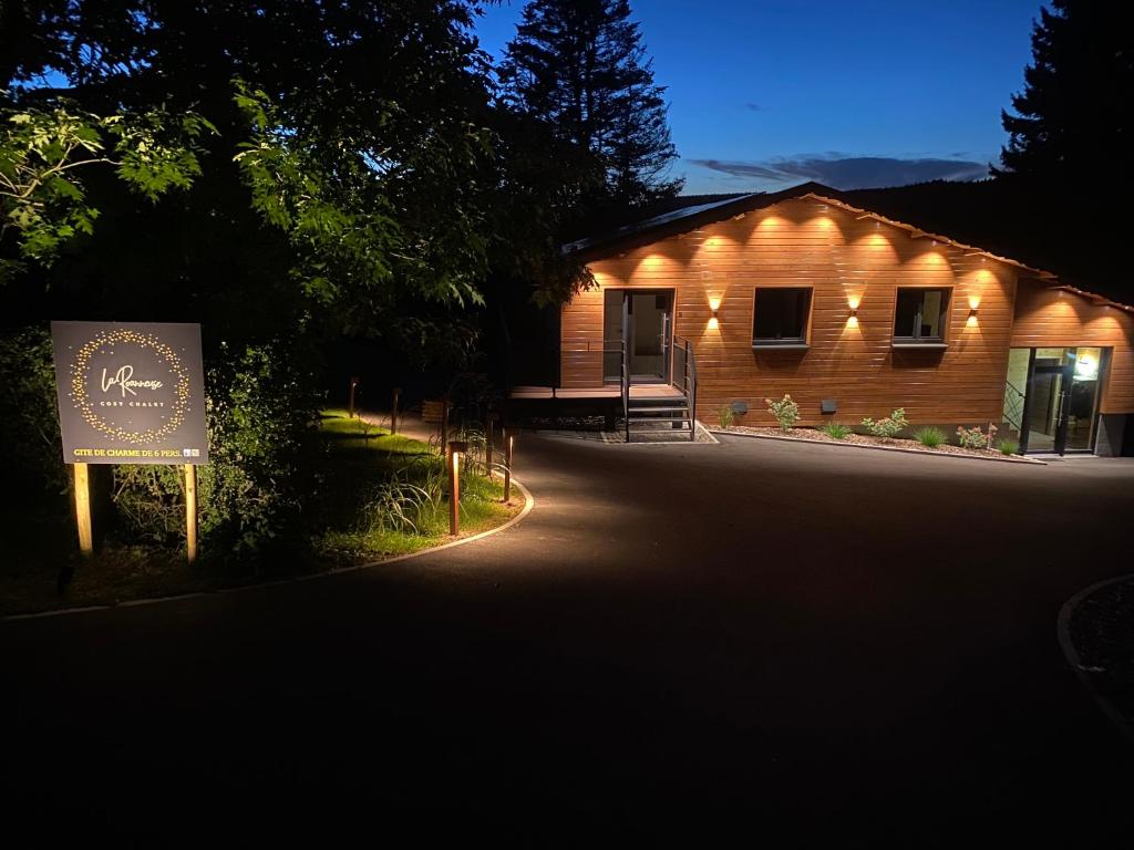 a building with a sign in front of it at La Roanneuse - Cosy Chalet in Francorchamps