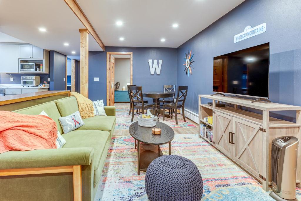 a living room with a couch and a table at Ski-InandSki-Out Condo in Upson - Walk to Lake in Upson