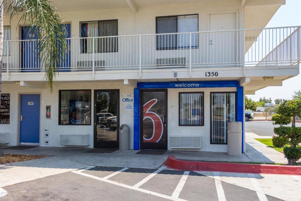 a building with a number on the door at Motel 6 Bakersfield, CA - Convention Center in Bakersfield