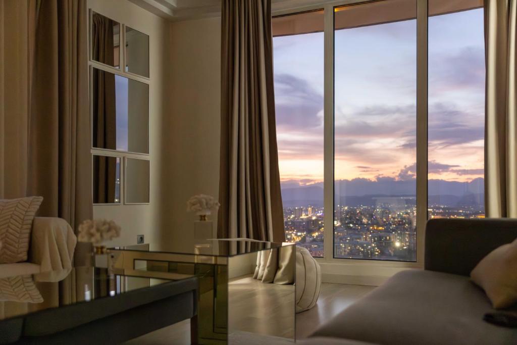a living room with a view of a city at Golden-Hour Loft 35F Sunset Views Free Parking in Gorno Lisiče