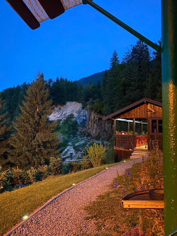 a cabin with a view of a mountain at Casa de Vacanta Cascada in Vidra