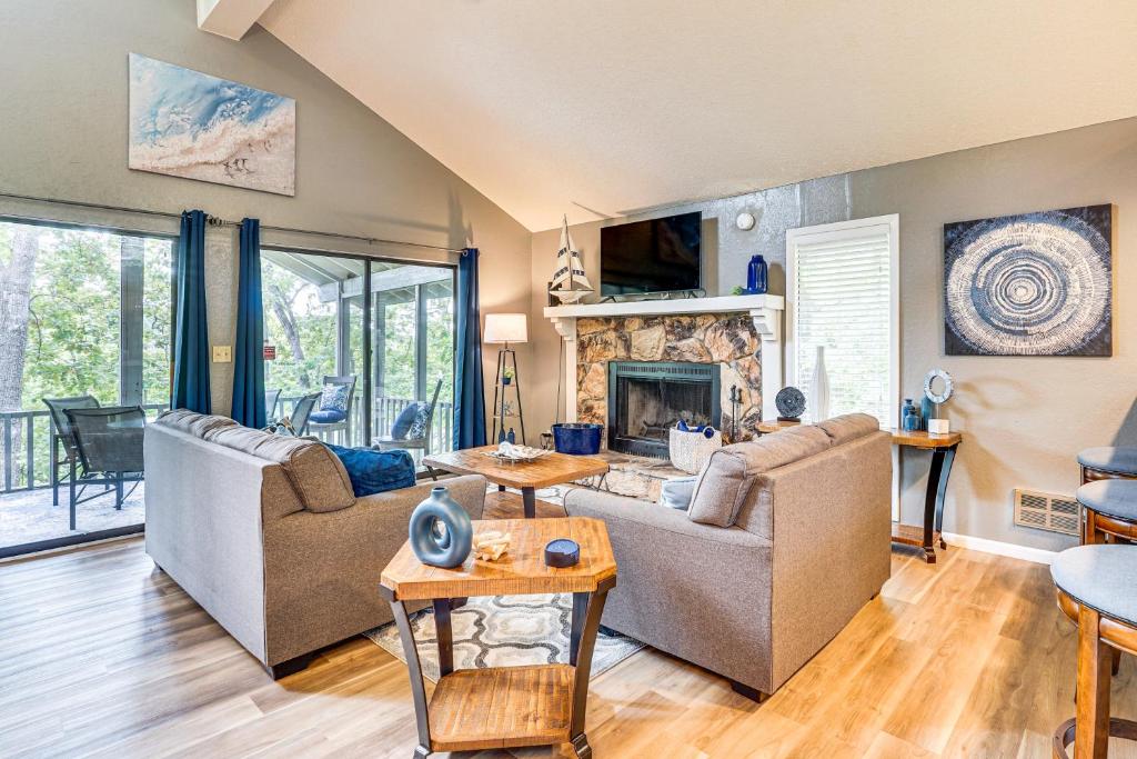 a living room with two couches and a fireplace at Margaritaville Lake Resort Home 1 Mi to Marina! in Damsel