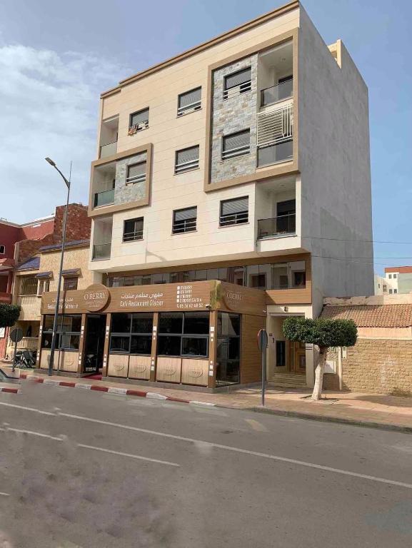 a building on the side of a street at La Brise Saidia in Saïdia