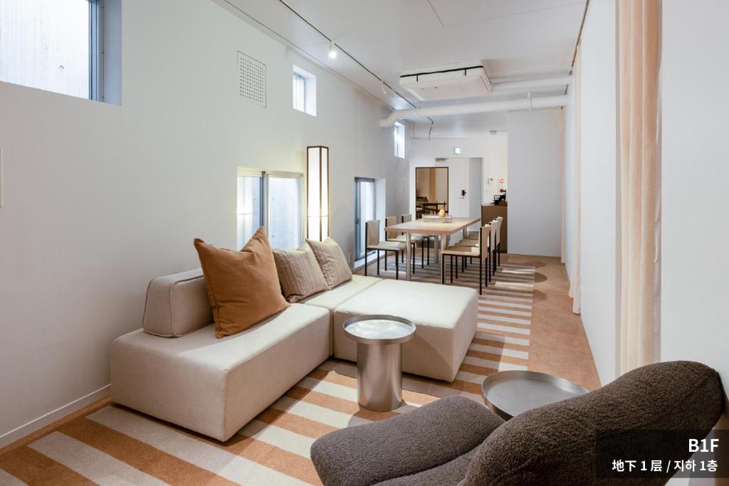 a living room with a couch and a table at JAPAVISTA r4 in Tokyo