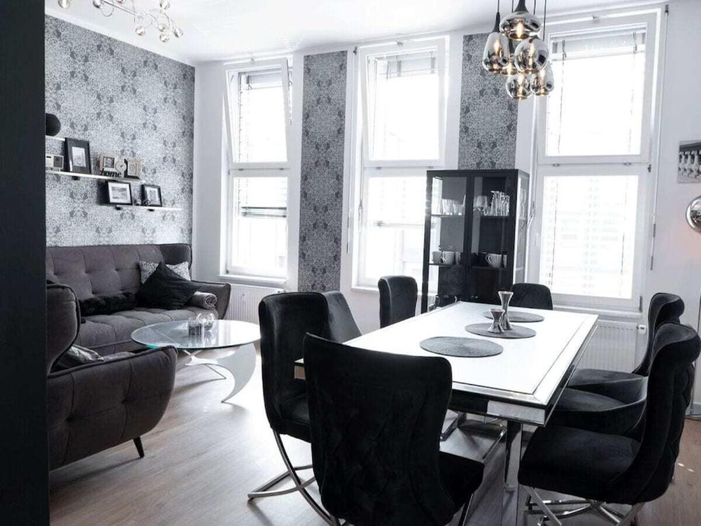 a living room with a dining room table and chairs at Holiday apartment with 4 bedrooms in Eisenach