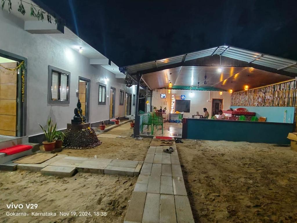 a house being remodeled with a patio and a living room at Golden Kudle Beach Resort in Gokarna