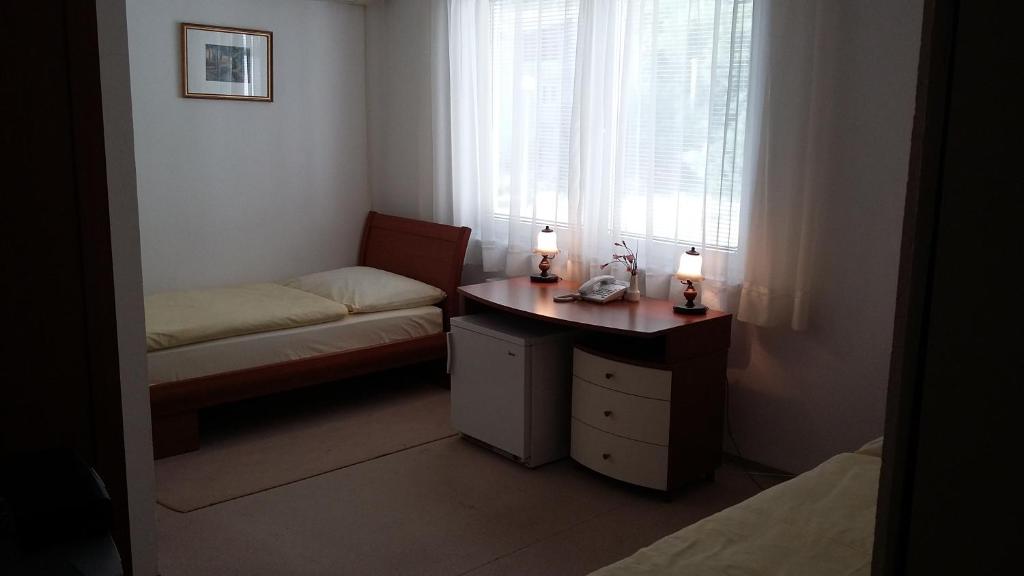Postel nebo postele na pokoji v ubytování Motel and Restaurant Odušak