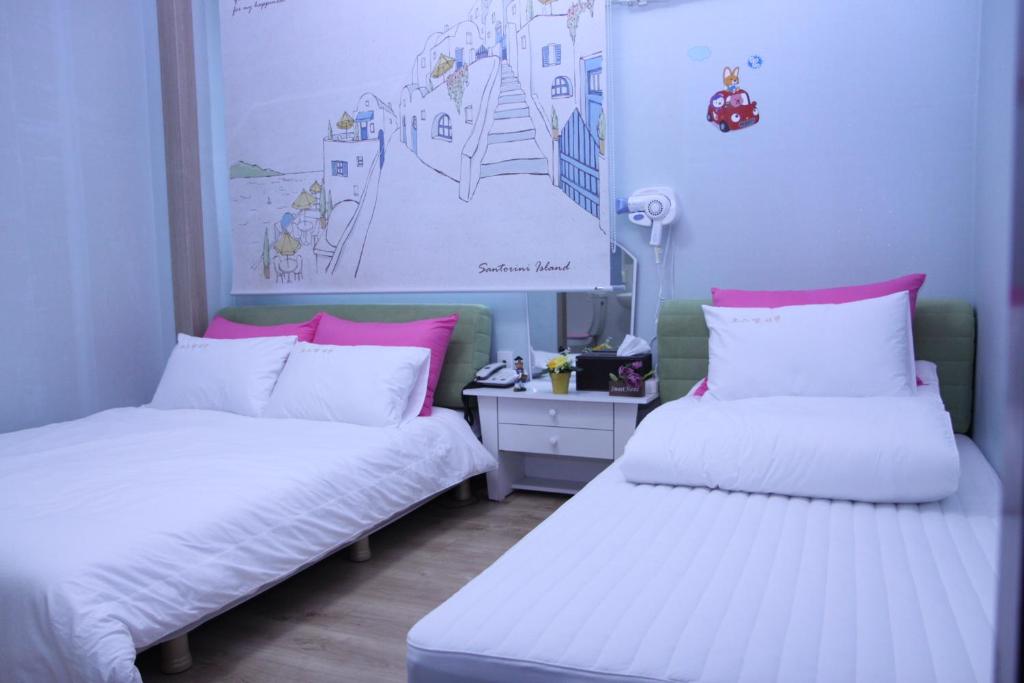 Postel nebo postele na pokoji v ubytování Hostel Dahyun & Guesthouse