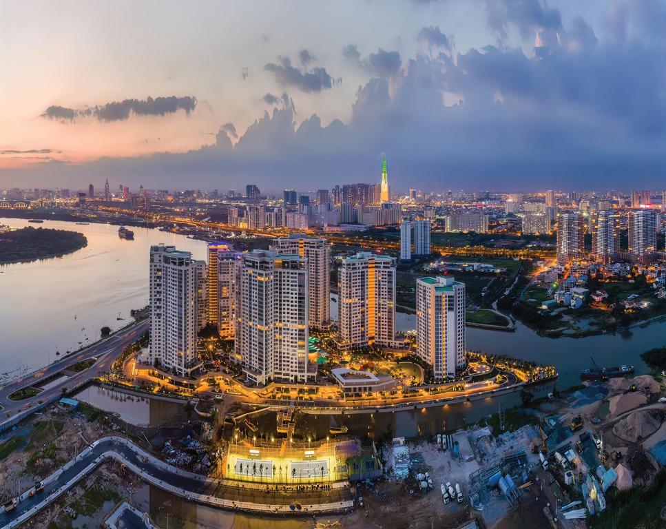an aerial view of a city at night at Diamond Island - Mekong Retreat Apartment in Ho Chi Minh City