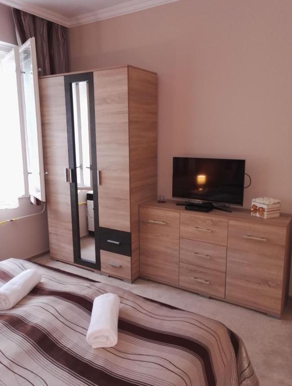 Postel nebo postele na pokoji v ubytování Adél Apartman