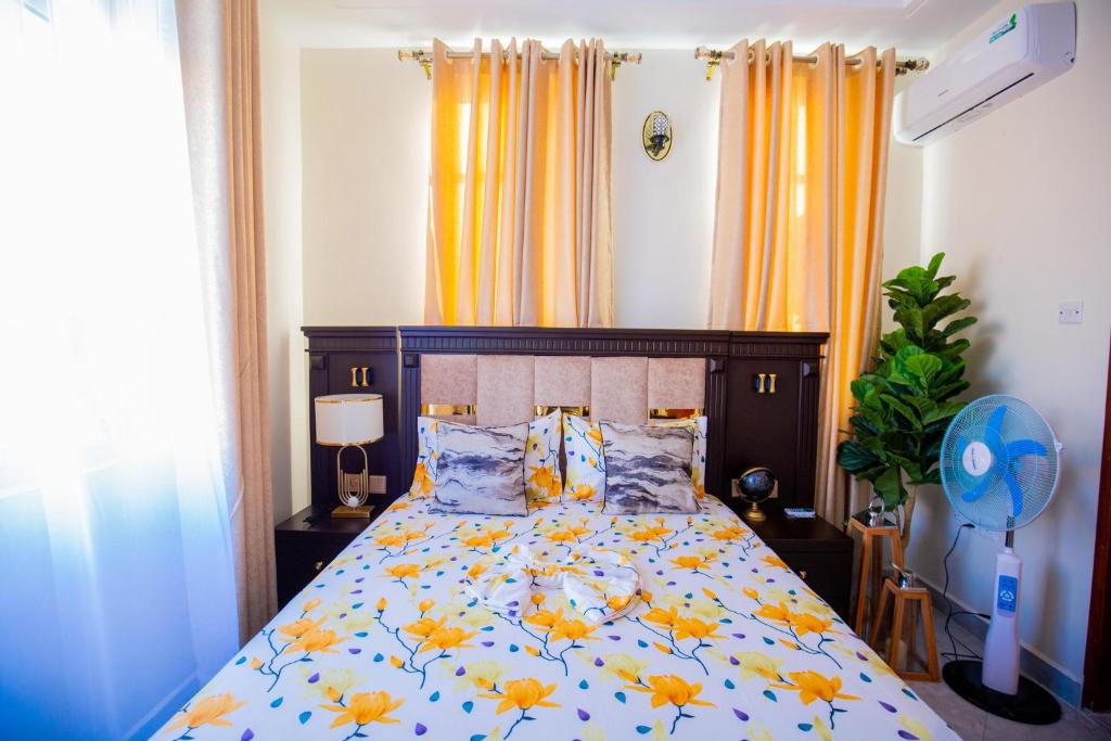 Ένα ή περισσότερα κρεβάτια σε δωμάτιο στο Hamidu City Park