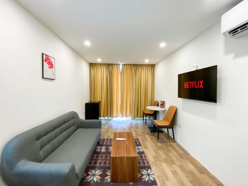 TV a/nebo společenská místnost v ubytování Eco Cozy Hotel Nam Ngu Street