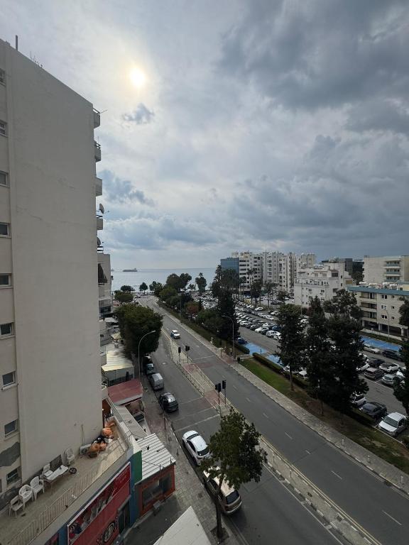 a view of a city with a building and a street at 3 bedroom seafront apartment in Limassol