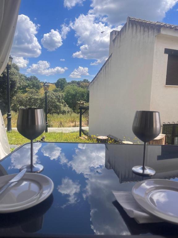 a reflection of the sky in a table with toilets at El rincón de Bonilla in El Ronquillo