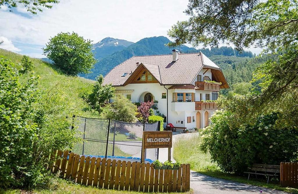 a house with a sign in front of it at Melcherhof in Trodena
