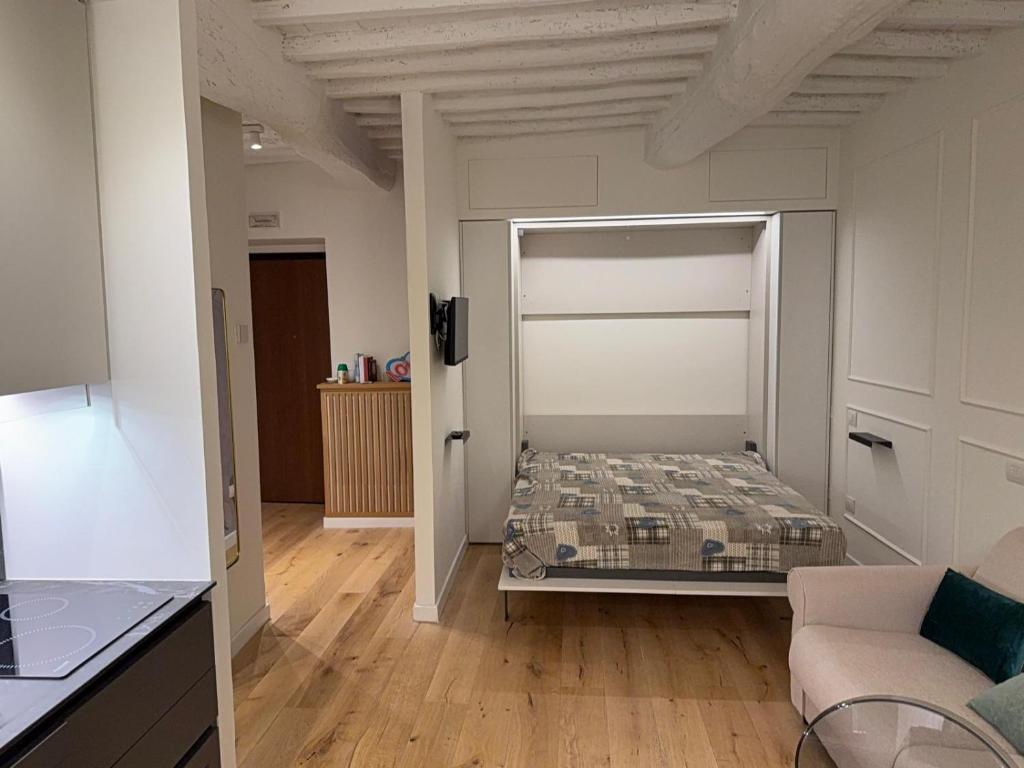 a room with a bed in the middle of a room at GL Suite Via Baglioni in Perugia