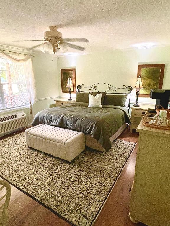 a bedroom with a bed and a ceiling fan at Dublin Farm in Dublin