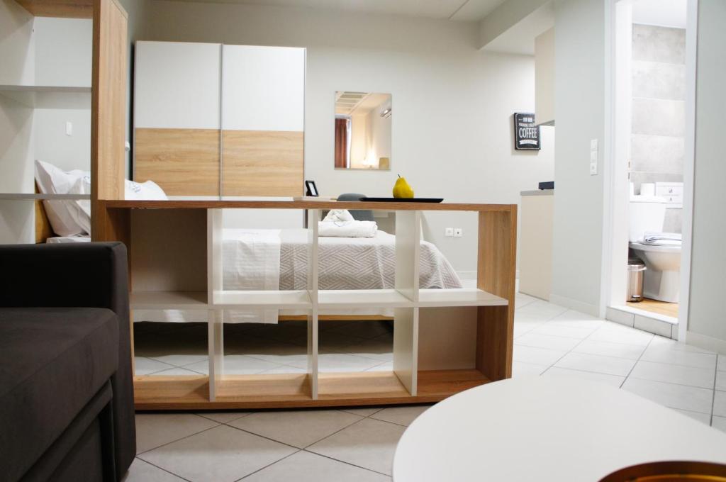 a bedroom with a desk and a bed in a room at A&I Apartments & Studios in Athens
