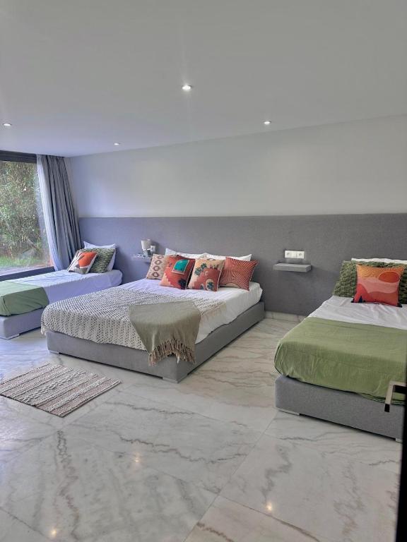 Postel nebo postele na pokoji v ubytování Prestige Duplex High Standing Marrakech