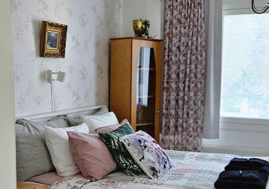 Postel nebo postele na pokoji v ubytování Huoneistomajoitus Unelma Mäntyharju