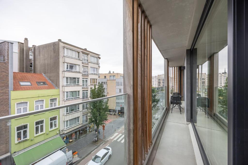 an apartment balcony with a view of a city street at Conrad City Stay - 176 in Ostend