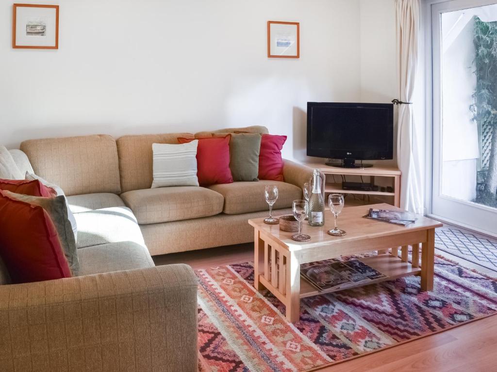 a living room with a couch and a coffee table at Chy Morvoren in Falmouth