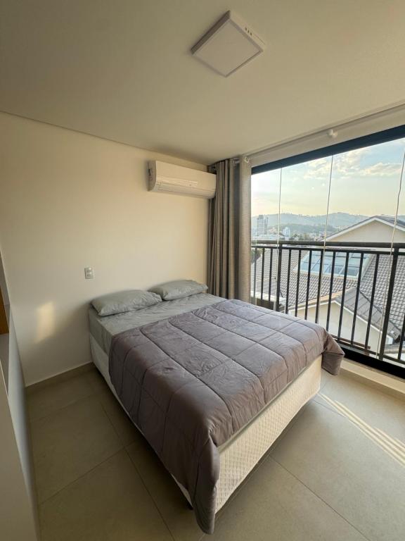 Katil atau katil-katil dalam bilik di Studio lindo com ar condicionado e piscina - Bela Vita - 309