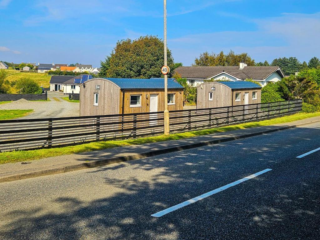a row of houses on the side of a road at Harris - Uk34048 in Stornoway