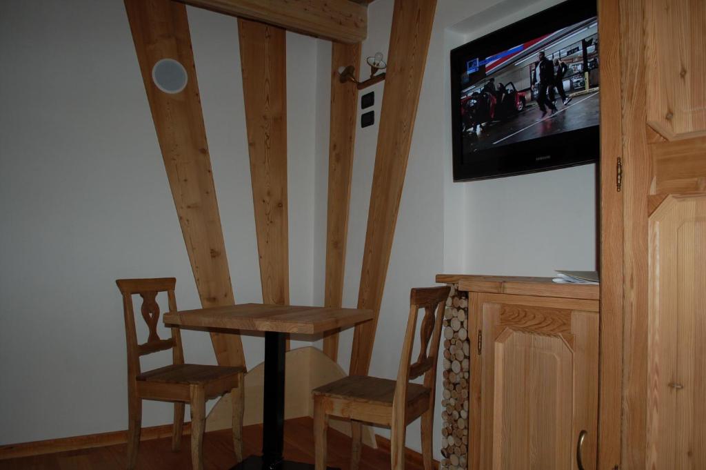 TV a/nebo společenská místnost v ubytování Residenza La Corte Dei Toldi