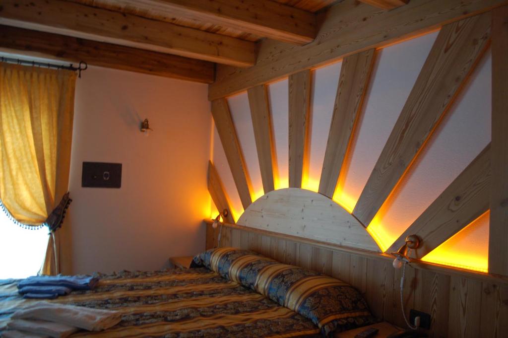 Postel nebo postele na pokoji v ubytování Residenza La Corte Dei Toldi