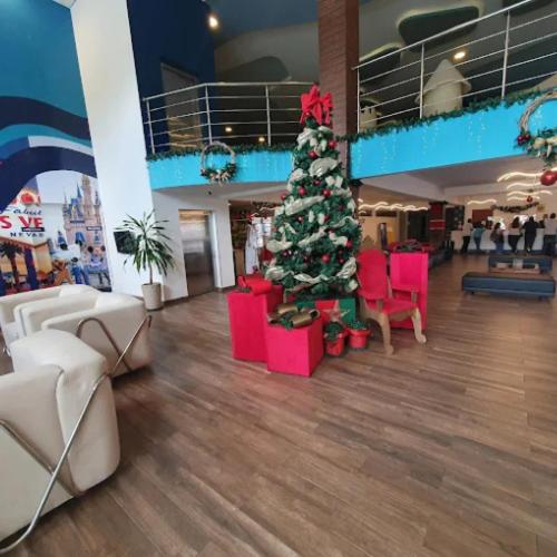 a christmas tree in the middle of a room at Nauticomar Resort All Inclusive - 23 a 30 de Nov in Porto Seguro