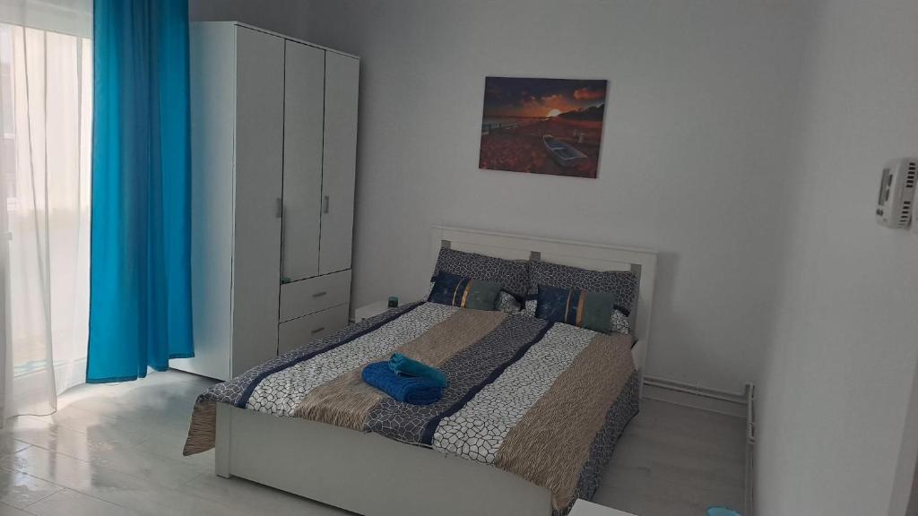 Ένα ή περισσότερα κρεβάτια σε δωμάτιο στο Aquamarin iulius mall studio