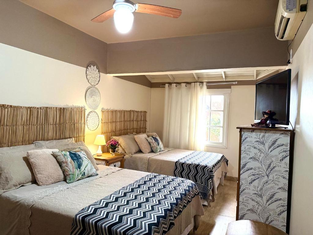 En eller flere senge i et værelse på Paraíso na praia 800 mts do mar