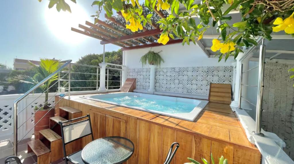a hot tub on the balcony of a house at Casa Mary Hotel in Cartagena de Indias