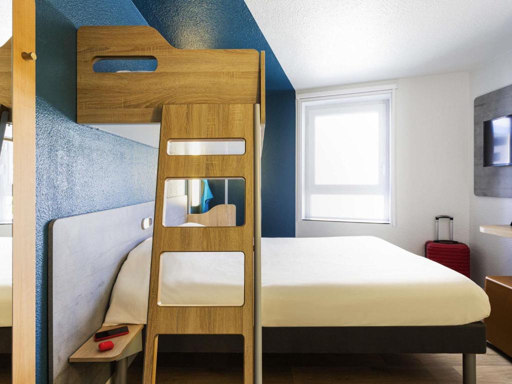 
Room with One Queen Bed and One Bunk Bed
