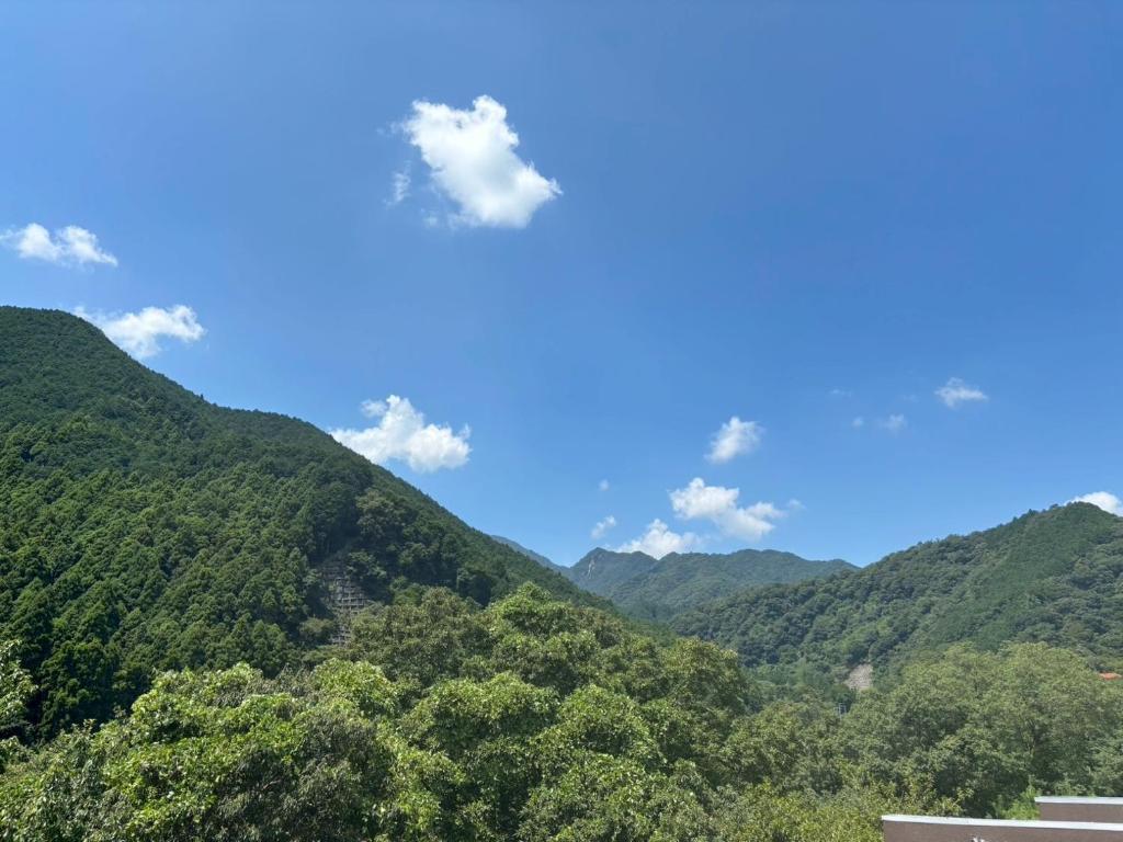 a view of the mountains with a blue sky at 大同ガーデンホテル湯の山リゾート in Wada