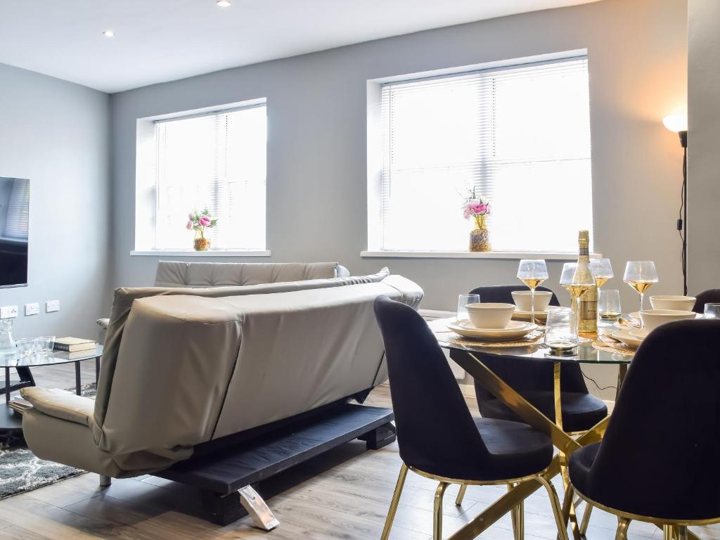 a living room with a couch and a table at Apartment 1 - Uk50135 in Stoke on Trent