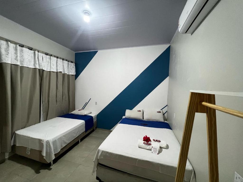 Postel nebo postele na pokoji v ubytování POUSADA E AGENCIA CLEDIO TURISMO