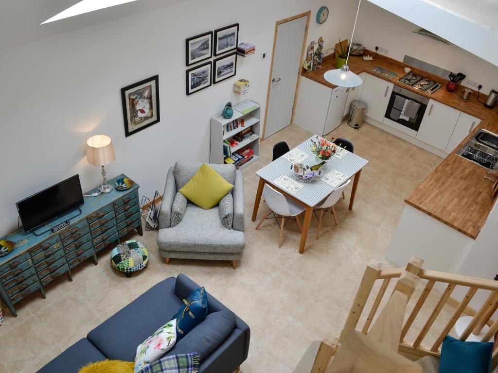 an overhead view of a living room with a table and chairs at Y Gweithdy in Barmouth